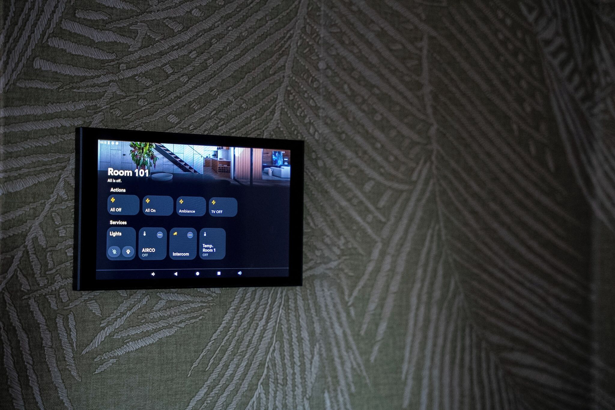 A digital control panel for Room 101 with options for lights, air conditioning, and TV.