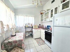 Fridge, microwave, oven, stovetop - The Pink House Unit C• Coastal Charm Steps from Bradenton Beach (Bradenton Beach)