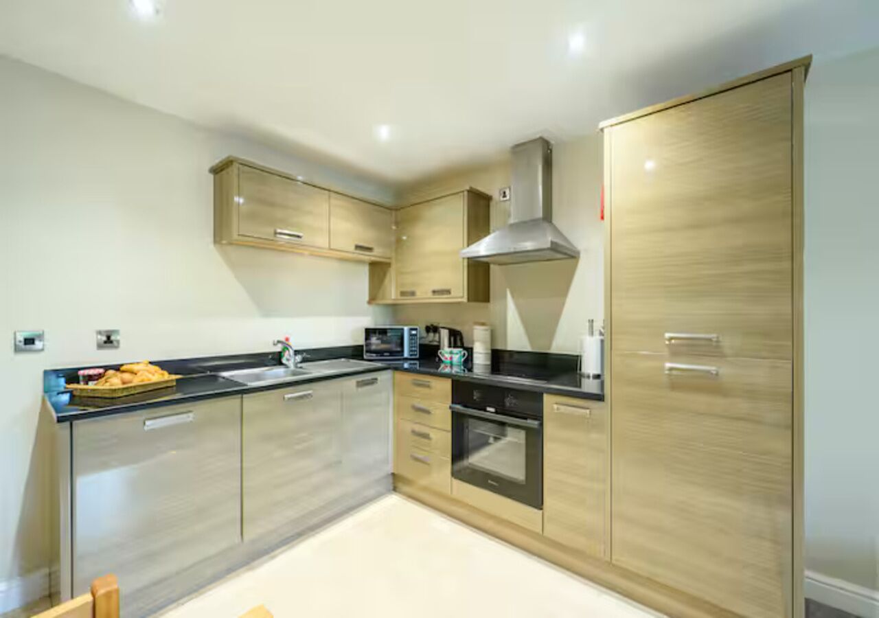 Fridge, oven, toaster, dining tables