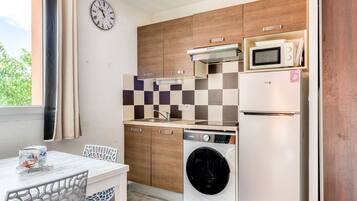 Fridge, microwave, cookware/dishes/utensils