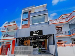 A modern building with a sign reading 'Collection Company-Service.'