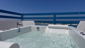 A hot tub with clear water, a faucet, and a control panel. - Spacious 3BR Apartment w Rooftop Terrace&Jacuzzi (Mersa Matruh)