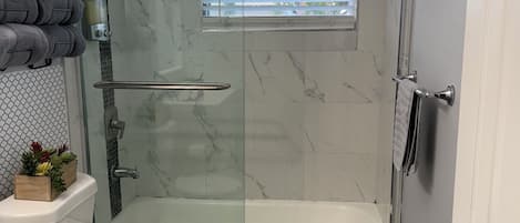 Shower, hair dryer, towels, soap