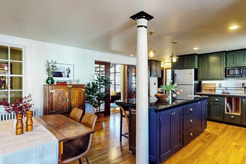 Elegant Victorian Gothic Revival home with wet bar, sunroom, & washer/dryer