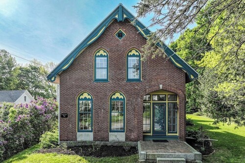 Elegant Victorian Gothic Revival home with wet bar, sunroom, & washer/dryer