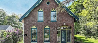Elegant Victorian Gothic Revival home with wet bar, sunroom, & washer/dryer