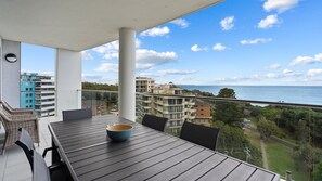 Outdoor dining - The Cove 903 Oceanview Apartment with Pool & Gym (Forster)