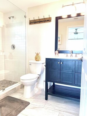 Shower, hair dryer, towels, toilet paper