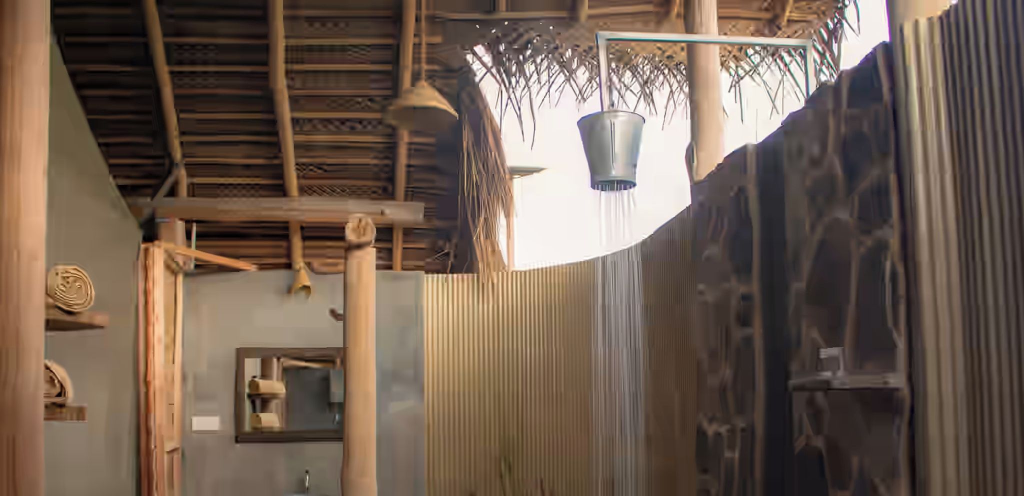 A room with a bamboo ceiling, a hanging light fixture, and a corrugated metal wall.