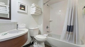 A bathroom with a sink, toilet, and bathtub. - Chicago Elgin / I-90, IL (Elgin)