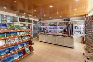 A bookstore with shelves of books, a counter with various items, and a sign for 'CROATIA'. - Hotel Jezero - Plitvice Lakes National Park (Plitvicka Jezera)