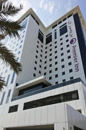 A modern hotel building with a prominent 'Premier Inn' sign, featuring a geometric facade and multiple balconies. - Premier Inn Dubai Ibn Battuta Mall (Dubai)