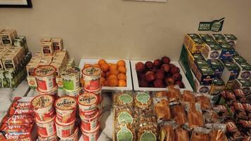A variety of food items including canned goods, fresh produce, and packaged snacks.