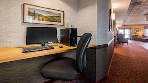 A hotel room with a desk, computer, and chair. - Saranac Lake (Saranac Lake)