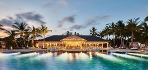 A resort with a large pool, palm trees, and a building with a covered area. - NH Collection Maldives Havodda Resort (Havodda)