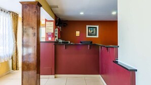A reception area with a counter, a framed picture on the wall, and a bulletin board with notices. - Fairbridge Inn Express Pittsfield MA (Pittsfield)