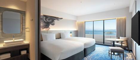 A hotel room with a large bed, a sitting area with a view, a bathroom with a large mirror, and a flat-screen TV.
