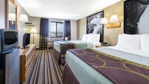 A hotel room with two beds, a TV, a desk with a lamp, and a large window. - Super 8 Sheridan (Sheridan)