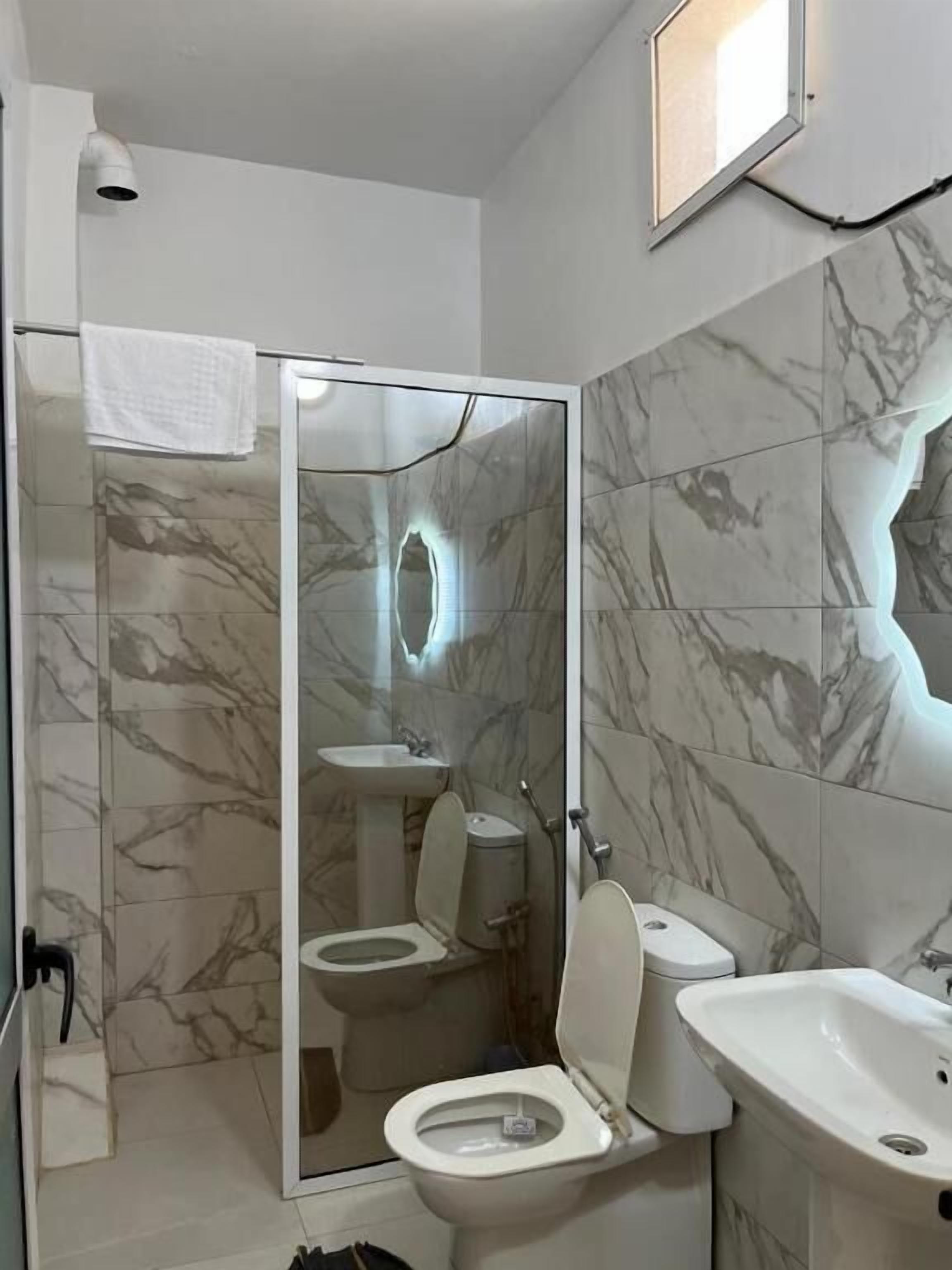 Shower, towels, toilet paper
