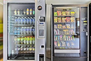 Two vending machines stocked with beverages and snacks. - Park Inn by Radisson, San Jose (San Jose)
