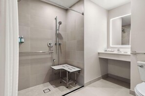 A modern bathroom with a shower, toilet, and vanity. - Hotel Atlantic City Oceanfront Boardwalk (Atlantic City)