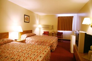 A hotel room with two beds, a desk, a chair, a television, and a window with curtains. - Super 8 by Wyndham Omaha SW (Omaha)