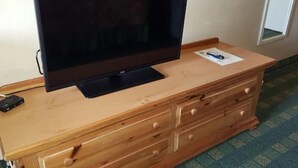 A television on a wooden dresser with drawers. - Motel6 Oriskany, NY (Oriskany)
