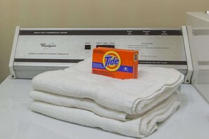 A Whirlpool heavy-duty commercial dryer with Tide detergent on top. - Houston/willowbrook/hwy 249 (Houston)