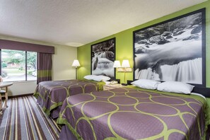 A hotel room with two beds, a large window, and a view of a waterfall. - Graystone Lodge, an Ascend Collection Hotel (Boone)