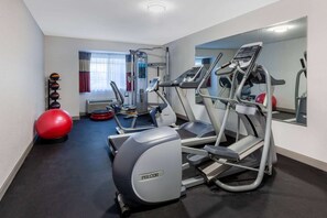 A gym with treadmills, elliptical machines, and exercise balls. - Microtel Inn & Suites by Wyndham Sunbury/columbus North (Sunbury)