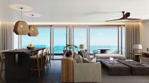 A modern hotel room with a large window, a dining area, a sofa, a coffee table, and a ceiling fan. - Impression Moxché by Secrets Adults Only (Playa del Carmen)