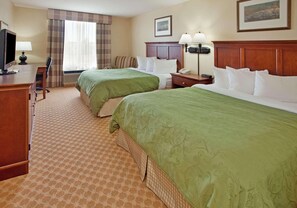 A hotel room with two beds, a desk with a computer, a TV, and a lamp. - Country Inn & Suites by Radisson, Birch Run-frankenmuth, MI (Birch Run)