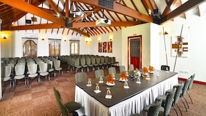 A conference room with a long table, multiple chairs, and a high ceiling with exposed beams. - Secrets St. Lucia Resort & Spa Adults Only (Gros Islet)