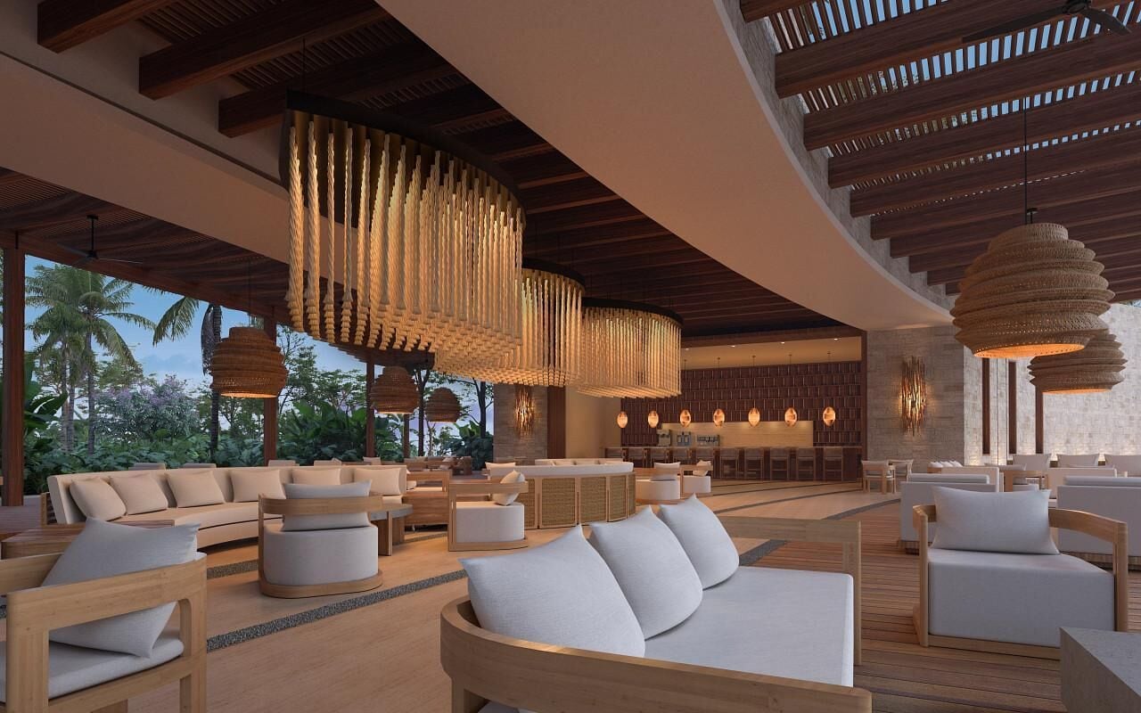 A modern lounge area with wooden furniture, hanging light fixtures, and a view of palm trees.