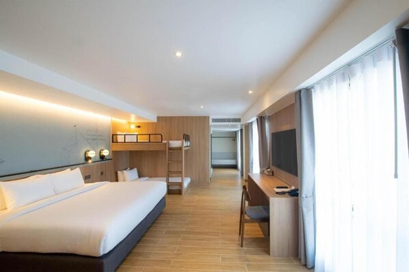 A hotel room with a bed, desk, and a view of the city. - Best Western Matter Tiwanon Hotel (Pak Kret)