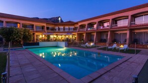 A hotel with a swimming pool, outdoor seating, and a mountain view. - Noemys Toulon La Valette (La Valette-du-Var)