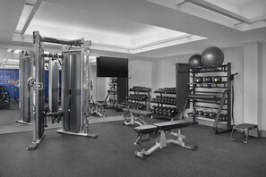 A gym with weight machines, dumbbells, and exercise balls. - Sleep Inn & Suites BWI Airport (Baltimore)
