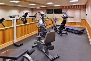 A gym with treadmills, ellipticals, and a stationary bike. - Wingate by Wyndham Elko (Elko)