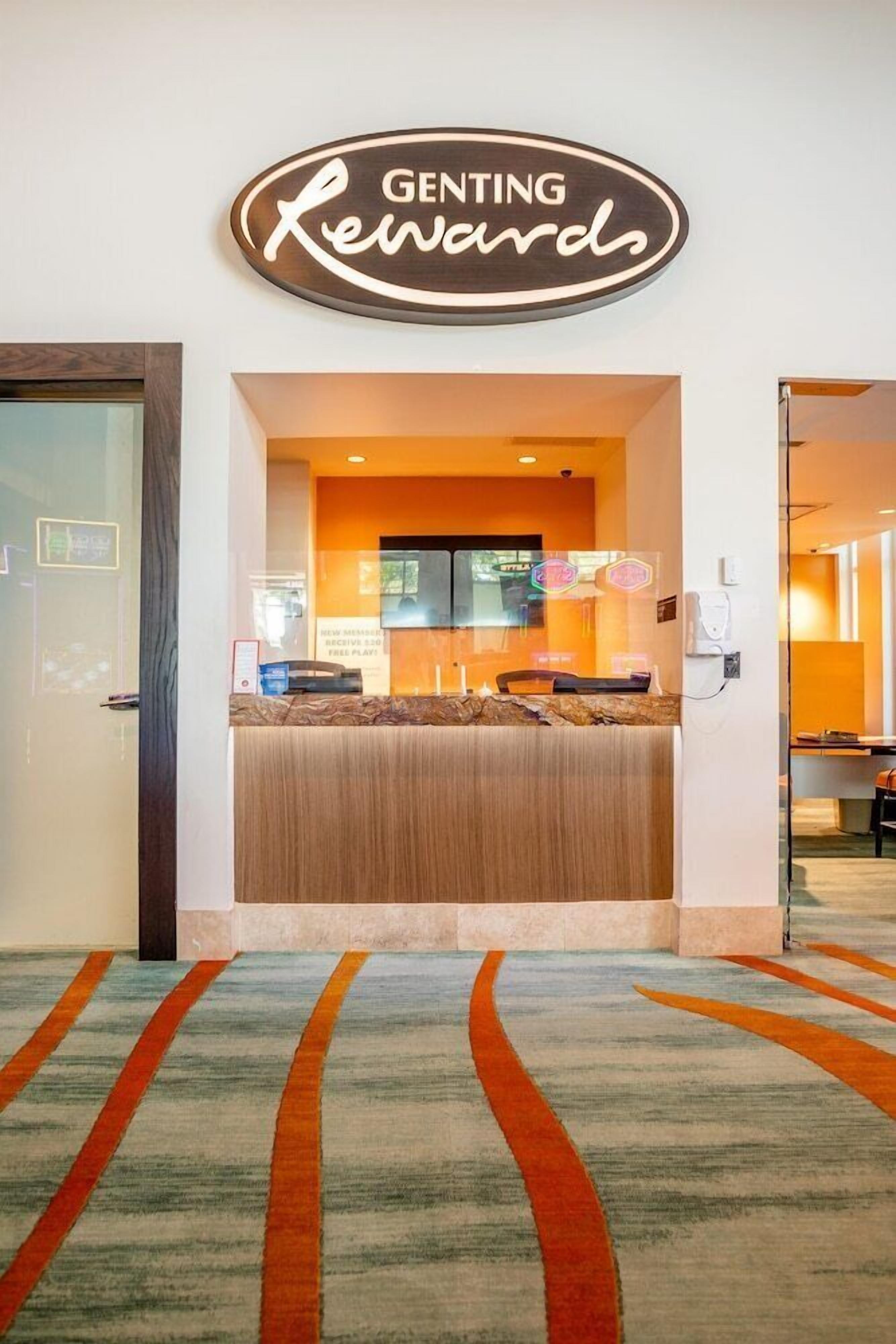 A reception desk with a sign above it that reads 'Genting Rewards.'