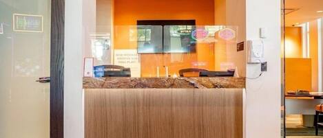 A reception desk with a sign above it that reads 'Genting Rewards.'