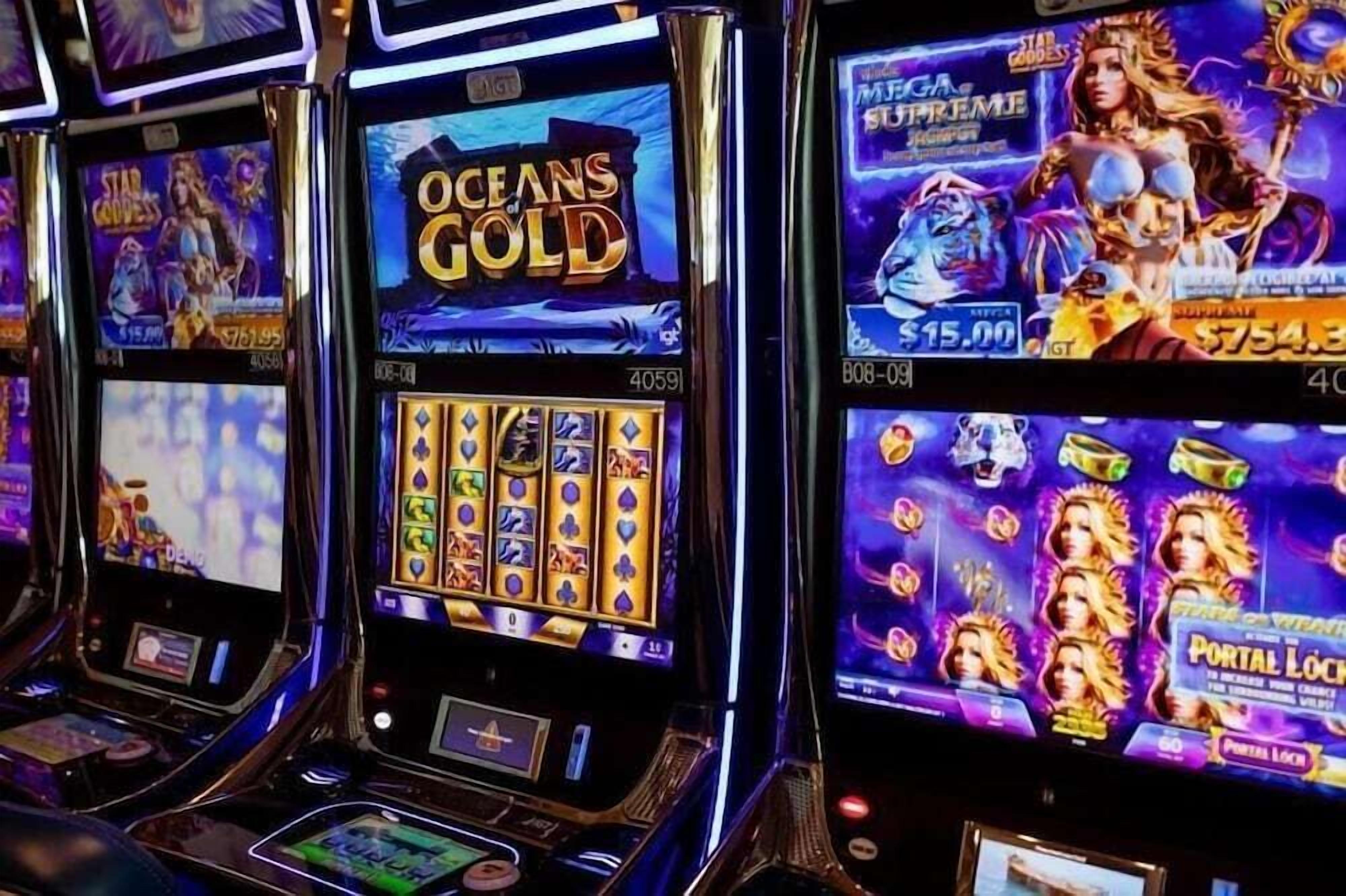 Slot machines with game titles like 'Oceans Gold' and 'Star Goddess'.