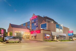 A multi-story building with 'RAMADA' and 'IHOP' signs, indicating a hotel and restaurant. - Ramada By Wyndham Niagara Falls By the River (Niagara Falls)
