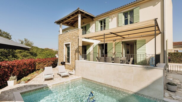 A two-story house with a swimming pool, outdoor seating, and a covered patio. - Villa Morgan – Luxury Villa with Heated Pool near Buje (Buje)
