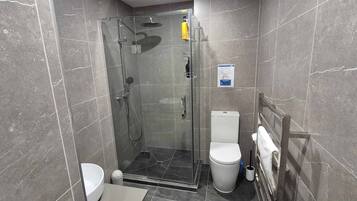 Shower, hair dryer, towels, soap