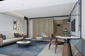 Suite, 1 cama King size y sofá cama, vista al océano | Sala de estar
