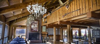 One Room Cabin with a double bed and small table with two chairs