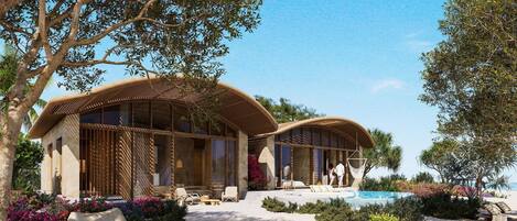 Una villa moderna con piscina, mobiliario de exterior y exuberante jardinería.