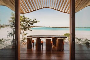 An open wooden structure with a table and chairs facing a beach. - Miraval The Red Sea, Adults Only, All Inclusive Resort (Umluj)