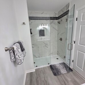 Shower, hair dryer, towels, soap