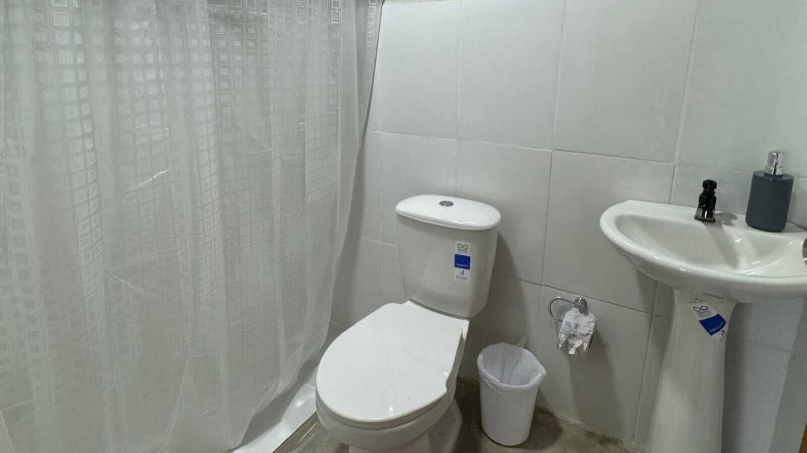 Shower, towels, soap, toilet paper